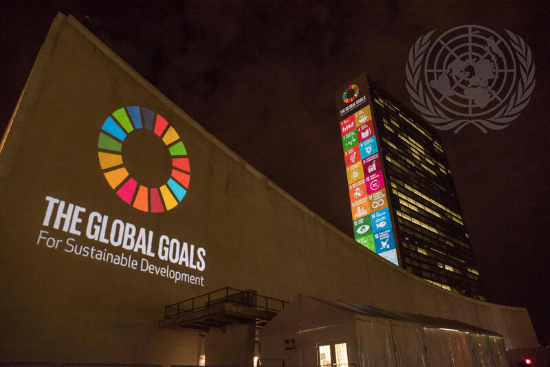 United Nations headquarters with the Global Goals for Sustainable Development projected on the building